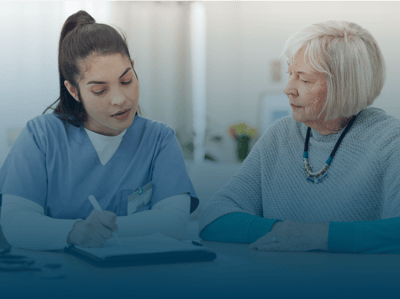 A staff member speaking with a resident