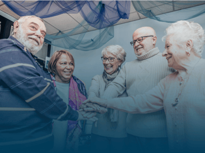 Residents and staff engaged in a joyful gathering