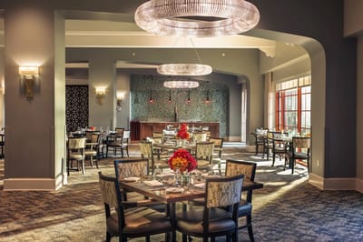 Elegant dining area with decorative lighting and flowers