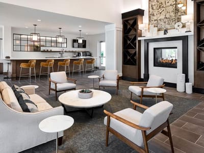 Modern common area with seating and fireplace