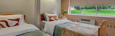 Cozy resident room with a view of green outdoor space