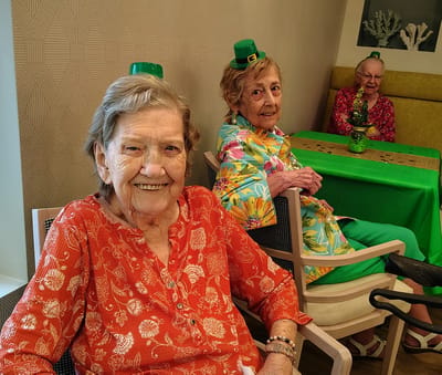 Residents enjoying a festive activity in a common area