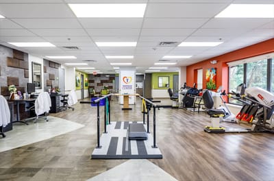 Rehabilitation gym with equipment and therapy area