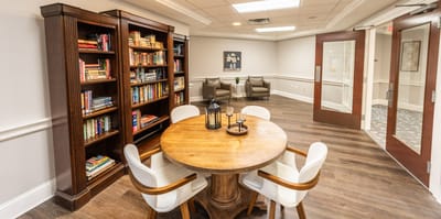 Cozy common area with bookshelves and seating