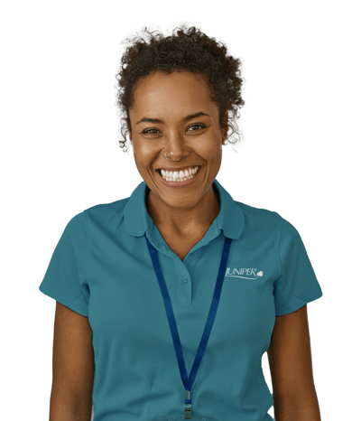 Staff member smiling in a uniform