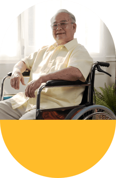 Smiling elderly man in a wheelchair