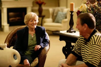 Residents enjoying conversation in a cozy common area