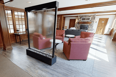 Cozy lounge area with comfortable seating and a water feature