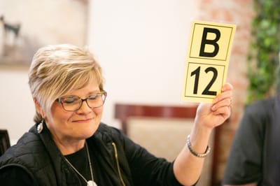 A staff member engaging with residents during an activity