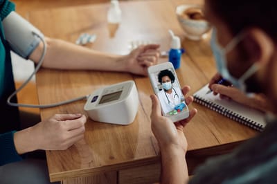 Healthcare professional consulting with a patient remotely