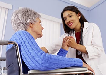 Enterprise Health & Rehabilitation Center, Nursing Home in Enterprise, AL — Healthcare professional consulting with a senior patient