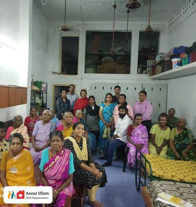 Residents gathered in a common area for a group photo