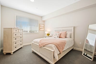 A well-furnished private resident room with bright lighting