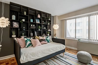 Brightly decorated living area with a daybed and plants