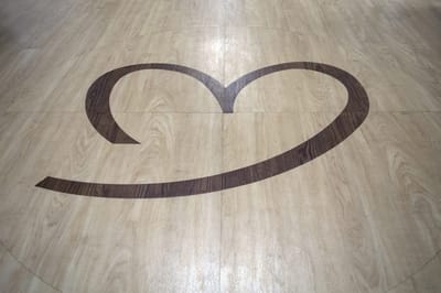 Stylized heart design on wooden floor
