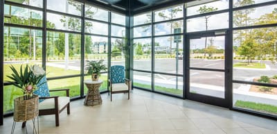 Bright interior lobby with large windows and seating