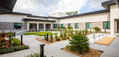Garden courtyard with accessible pathways and landscaping