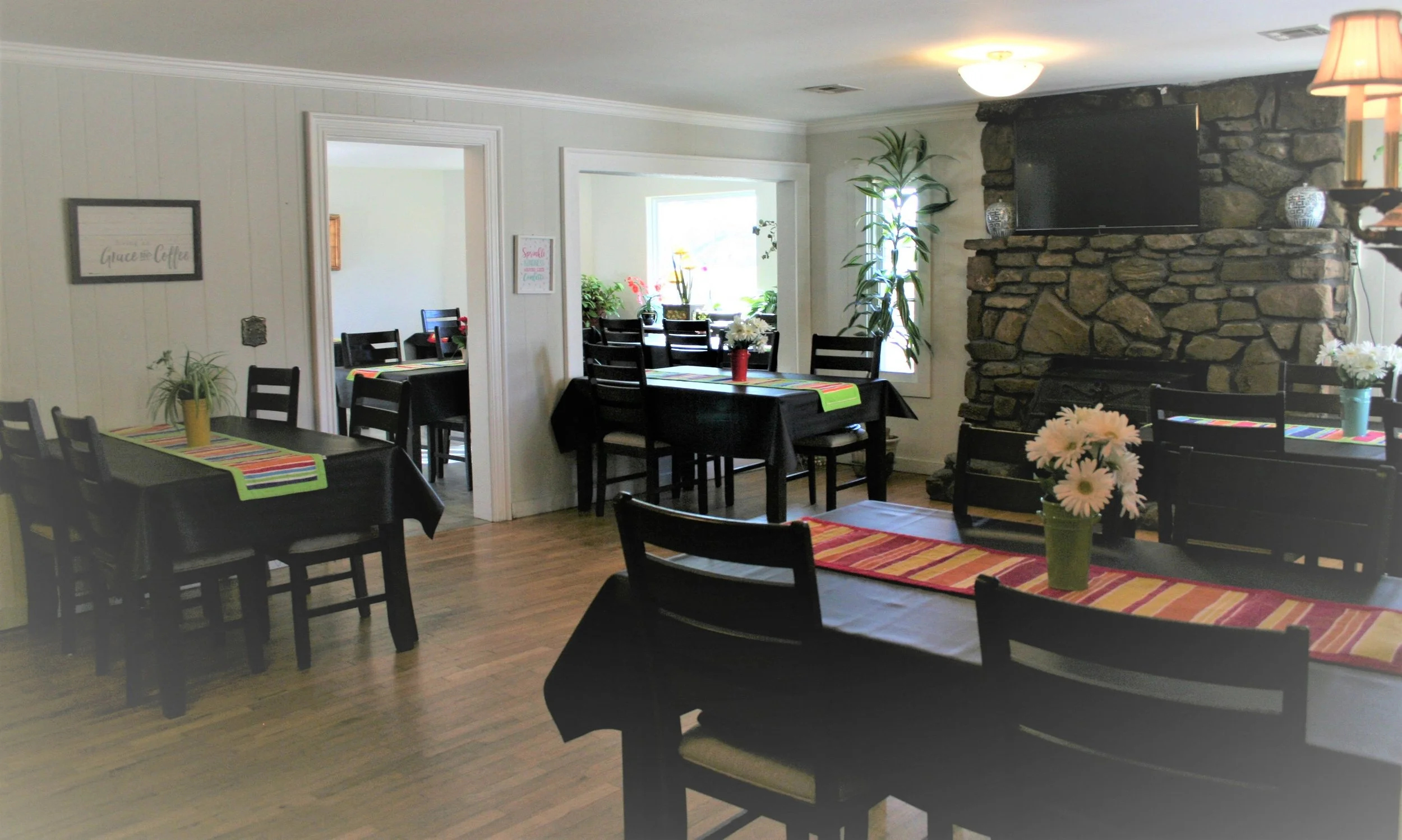 Dining area with tables set for residents