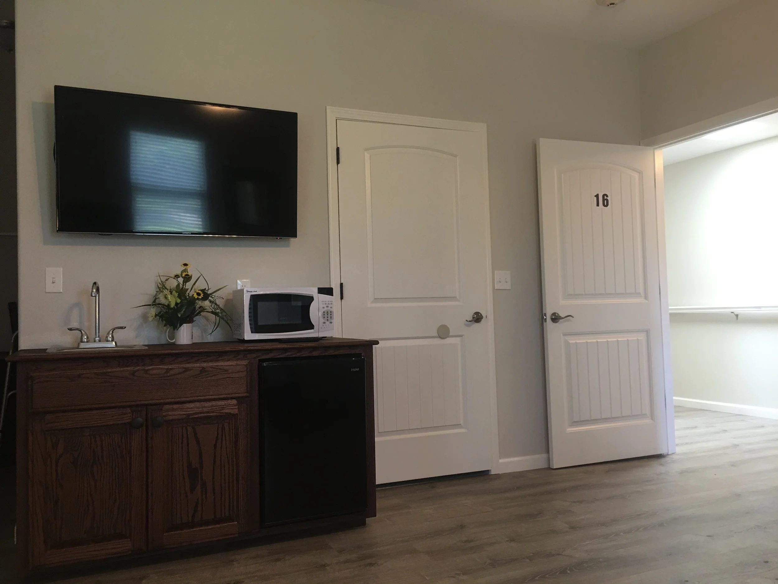 Interior view of a resident's room with amenities