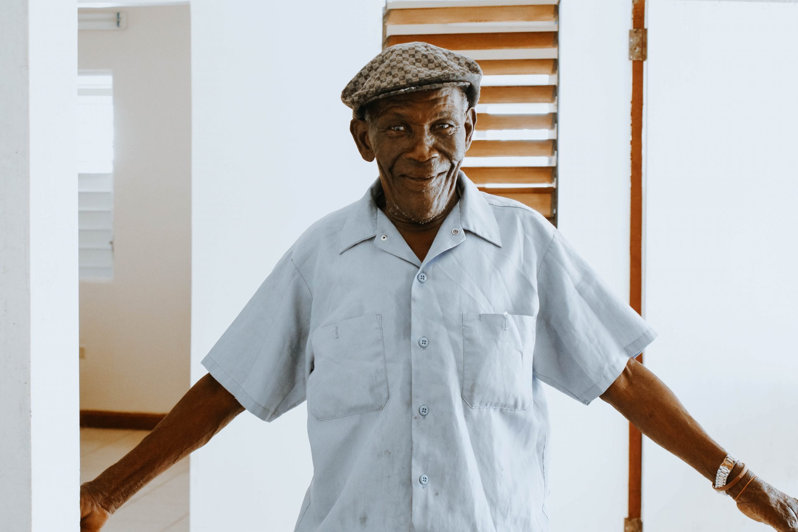 Smiling resident in a facility interior
