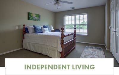 A well-furnished independent living room with a bed