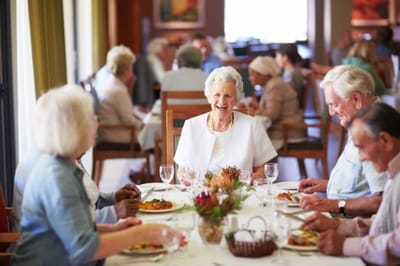 Residents enjoying a meal in the dining room