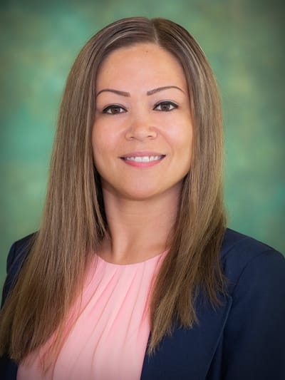 Professional portrait of a staff member in a suit