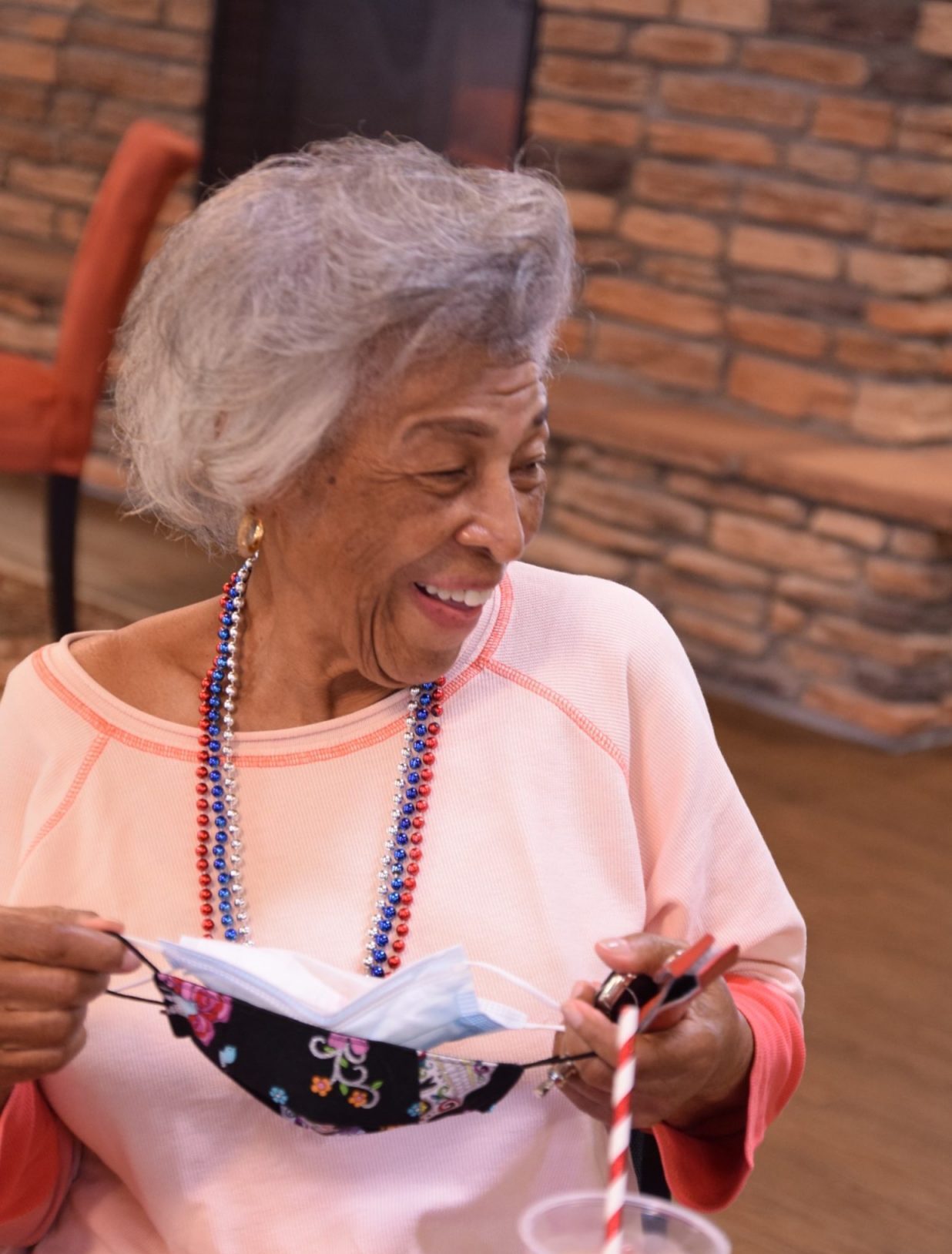 Resident enjoying an activity with a mask