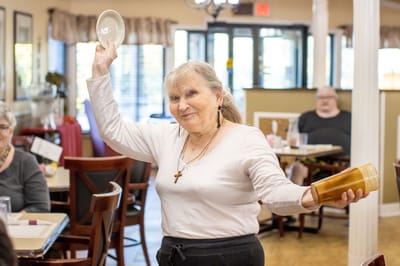 Resident enjoying activity in the dining room
