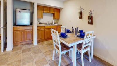 Bright dining area with a table set for meals