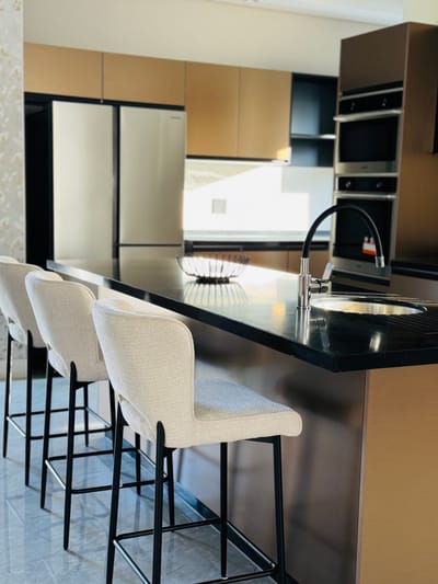 Modern kitchen interior with bar stools
