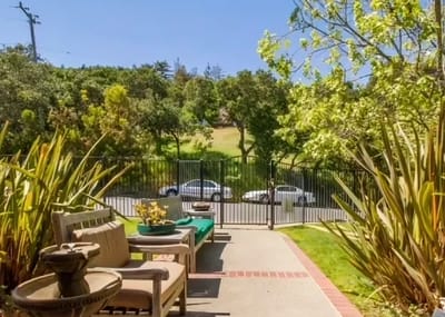 Outdoor seating area with a garden view