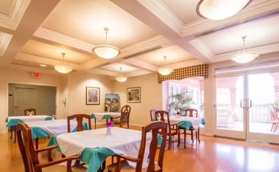 Bright dining area with tables and chairs