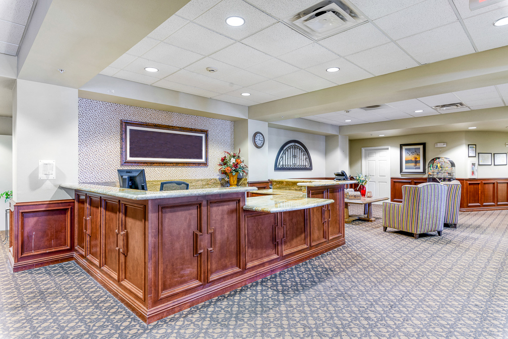 Interior view of reception area with desk and seating