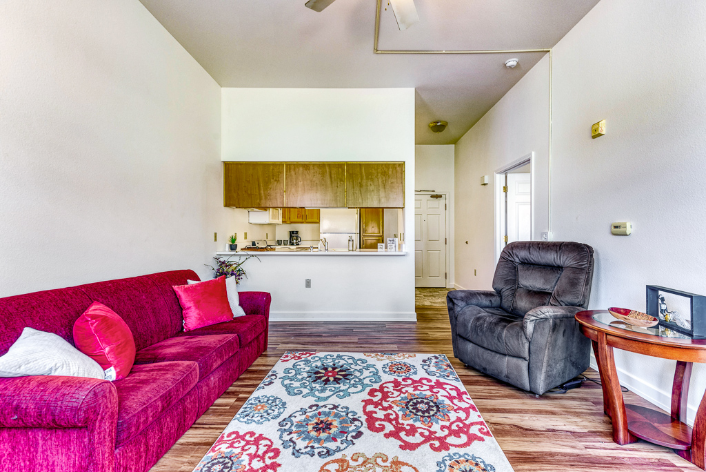 Bright interior living space with seating and kitchen