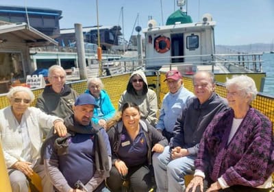 Residents and staff enjoying a boat outing