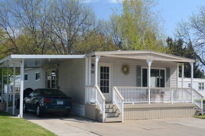Exterior view of a residential building with car