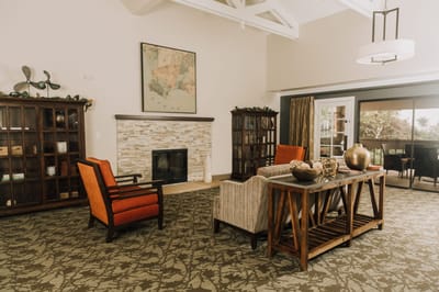 A cozy common area with seating and decorative elements