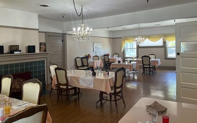 Bright dining room set for meals with tables and chairs