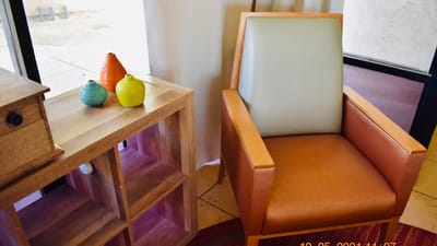 A cozy seating area with a chair and decorative items
