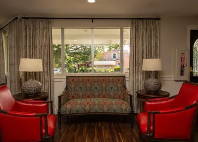 Bright interior lobby with seating and lamps