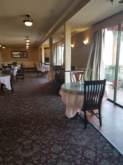 Bright dining area with tables and chairs