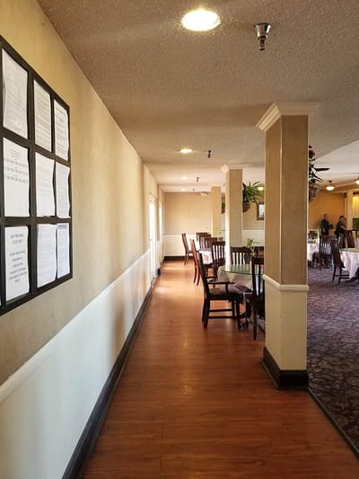 Interior view of a dining area with tables and seating