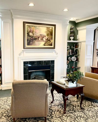Cozy common area with a fireplace and artwork