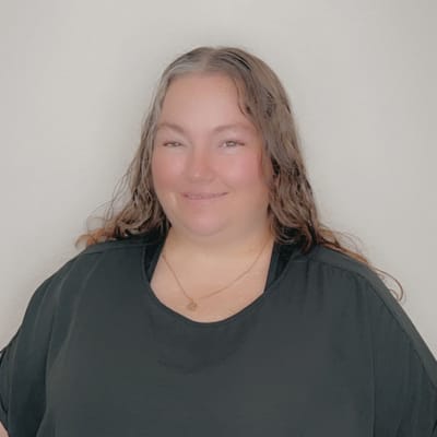 A woman smiling in a casual setting