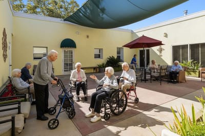Residents enjoying time outdoors in a courtyard