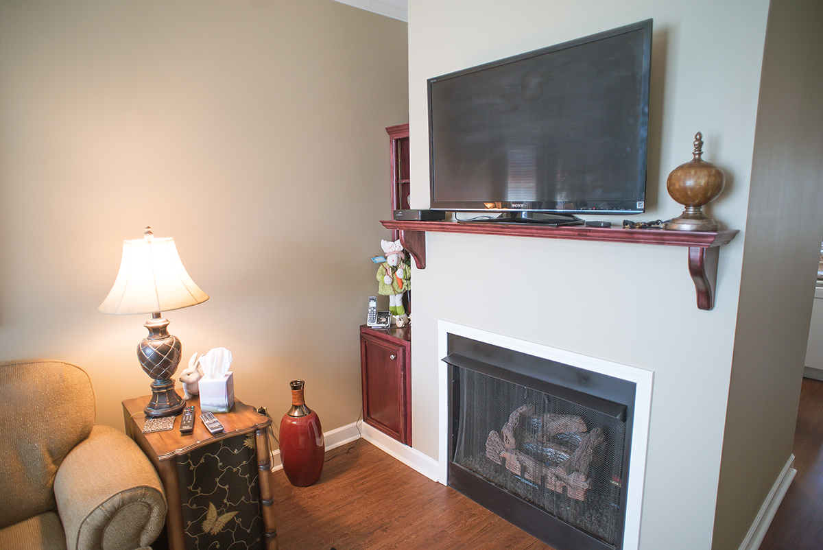 Cozy lounge area with a TV and lamp