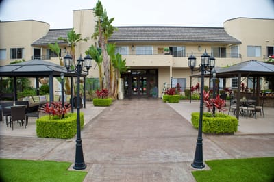 Exterior view of Coronado Retirement Village with landscaping