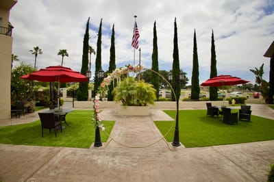 Outdoor area with seating and decorative arch