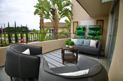 Outdoor seating area with plants and decor
